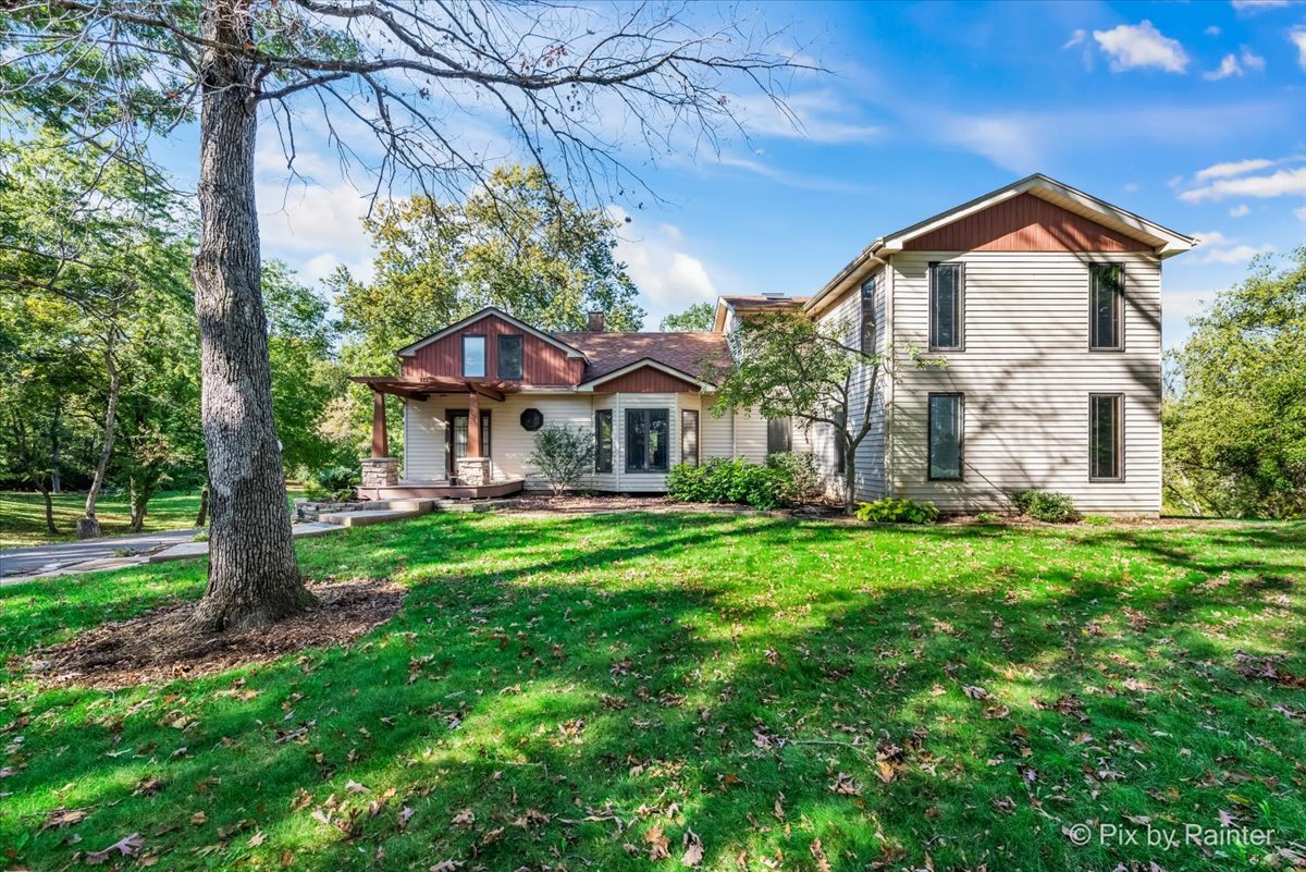 322 West Dowell Road McHenry, IL 60051 - Photo 1 of 40 a front view of a house with a yard