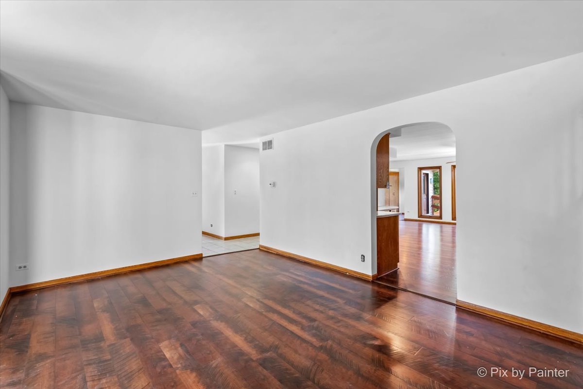322 West Dowell Road McHenry, IL 60051 - Photo 11 of 40 a view of empty room with wooden floor and fan