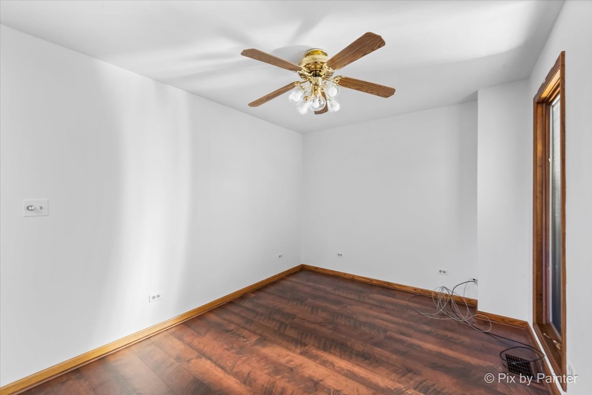 322 West Dowell Road McHenry, IL 60051 - Photo 12 of 40 an empty room with wooden floor and windows