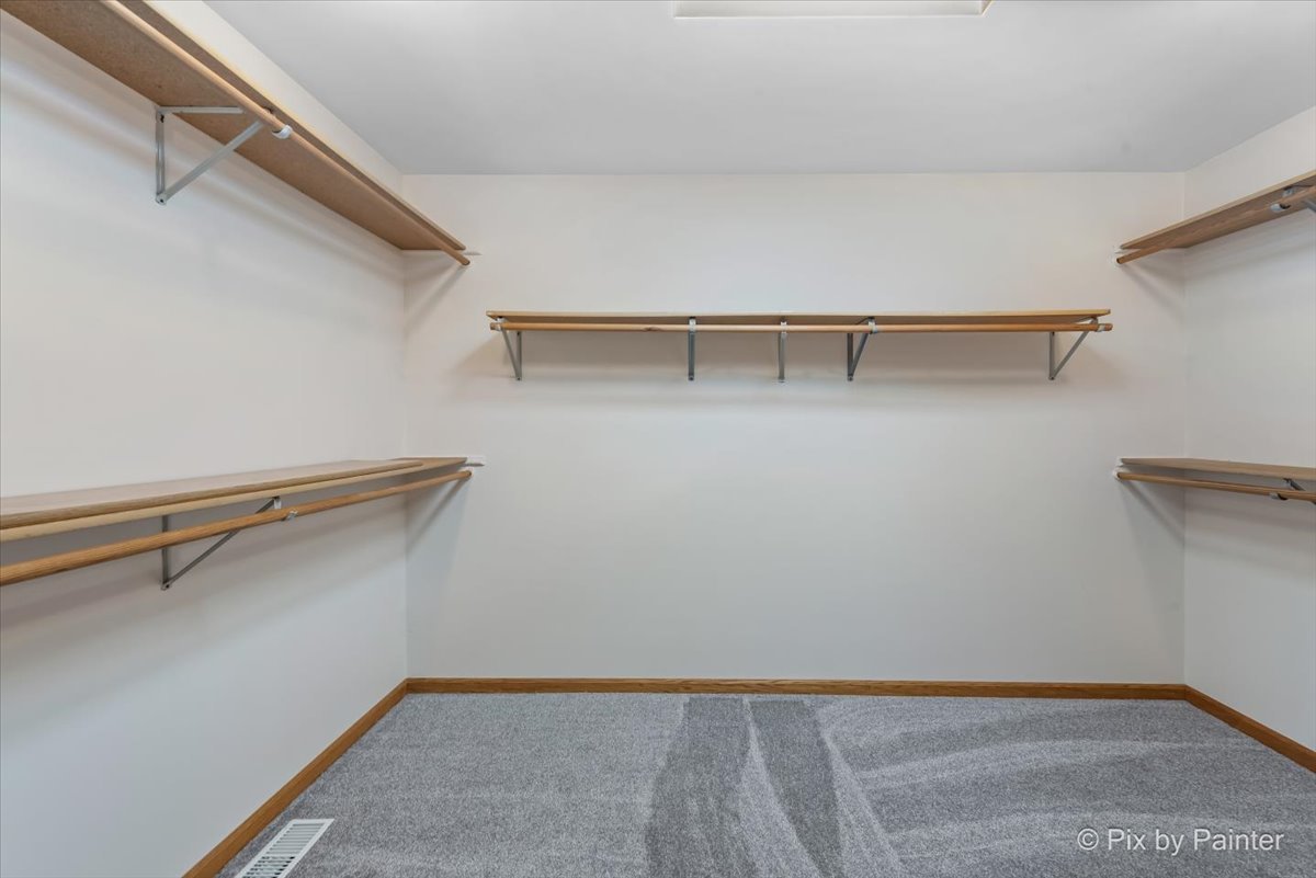 322 West Dowell Road McHenry, IL 60051 - Photo 18 of 40 a view of walk in closet with empty racks