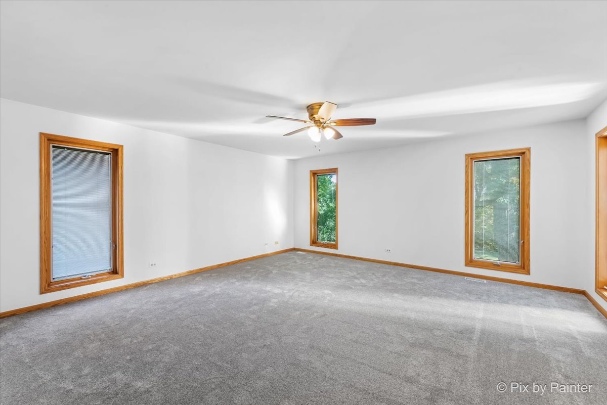 322 West Dowell Road McHenry, IL 60051 - Photo 19 of 40 a view of an empty room with window and closet area