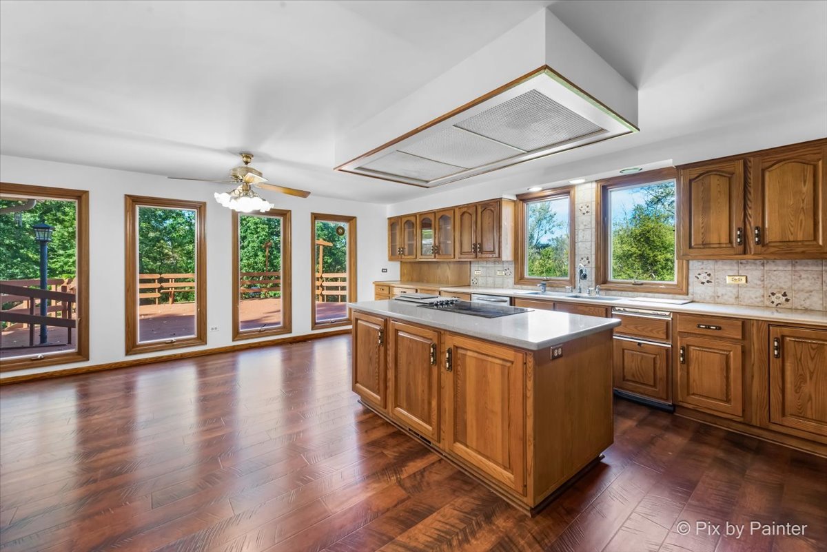 322 West Dowell Road McHenry, IL 60051 - Photo 2 of 40 a kitchen with stainless steel appliances granite countertop a stove and a large cabinets