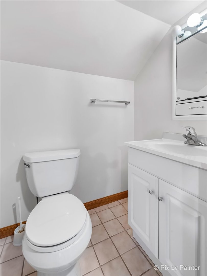 322 West Dowell Road McHenry, IL 60051 - Photo 26 of 40 a bathroom with a toilet sink and mirror