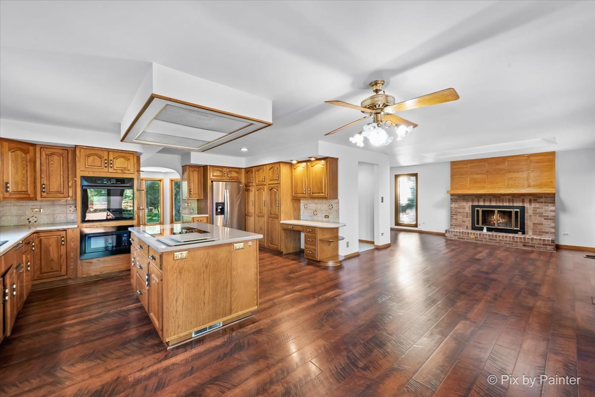 322 West Dowell Road McHenry, IL 60051 - Photo 3 of 40 a living room with fireplace furniture and a large window