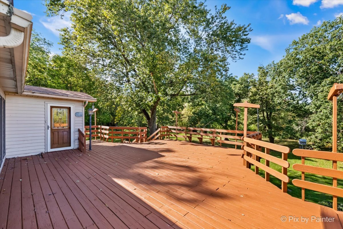 322 West Dowell Road McHenry, IL 60051 - Photo 39 of 40 a view of a chairs and table on the wooden roof deck