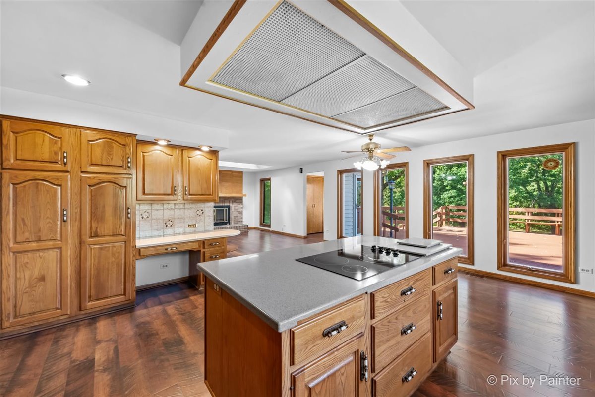 322 West Dowell Road McHenry, IL 60051 - Photo 5 of 40 a kitchen with sink refrigerator and stove