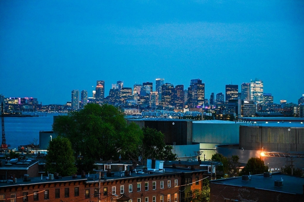 23 Chestnut Street, Unit 5 Chelsea, MA 02150 - Photo 15 of 17 a city view with tall buildings