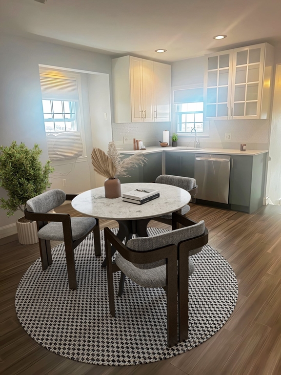 23 Chestnut Street, Unit 5 Chelsea, MA 02150 - Photo 3 of 17 a view of a a dining room with furniture window and wooden floor
