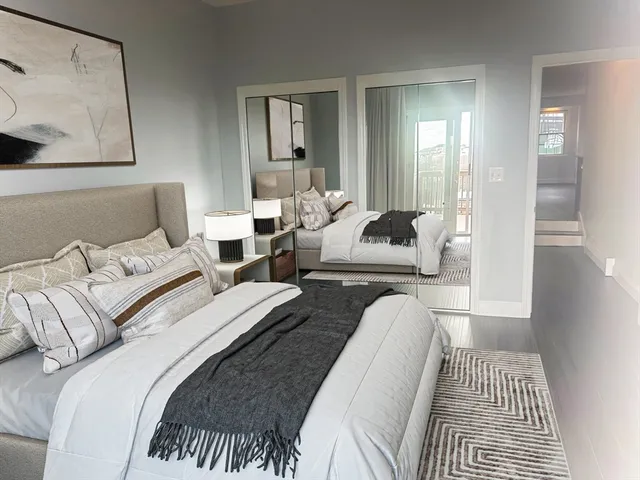 a bedroom with bed and a couch