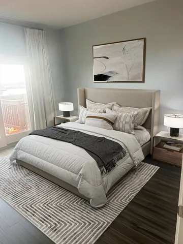 a bedroom with a bed and a couch