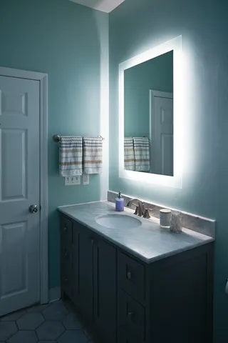 a bathroom with a sink and a mirror