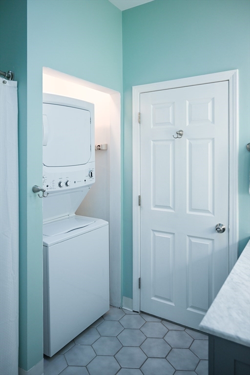 23 Chestnut Street, Unit 5 Chelsea, MA 02150 - Photo 9 of 17 a view of a storage and utility room with washer and dryer