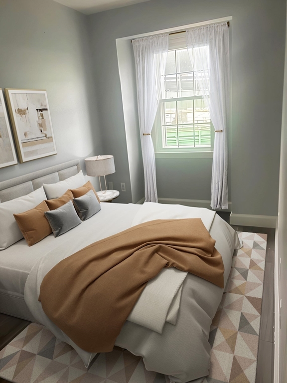 23 Chestnut Street, Unit 5 Chelsea, MA 02150 - Photo 10 of 17 a bedroom with double bed and a window