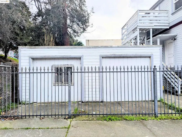 a view of a wrought iron fences in front of house