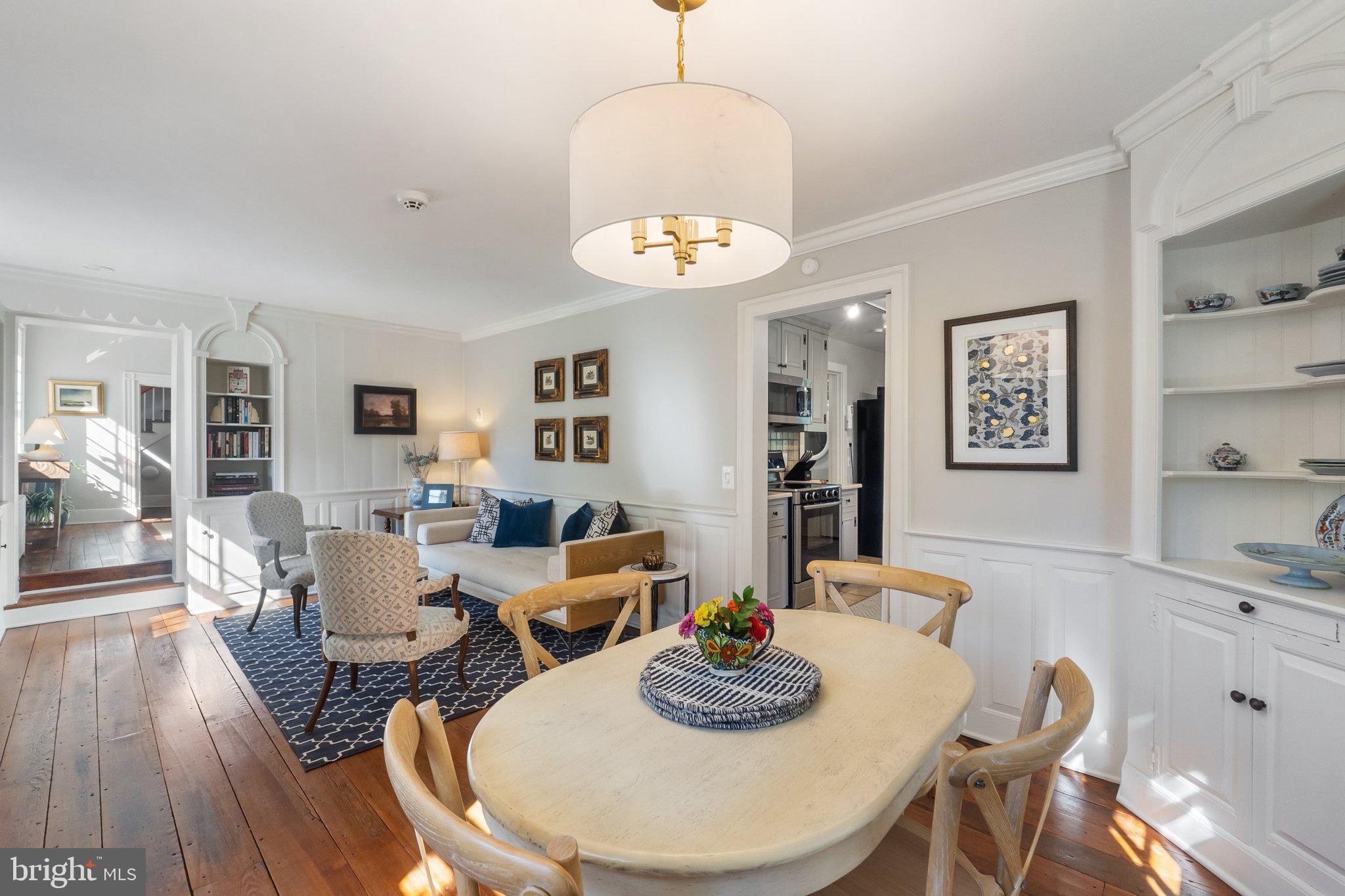 677 Federal Street Paris, VA 20130 - Photo 25 of 82 a living room with dining table and wooden floor