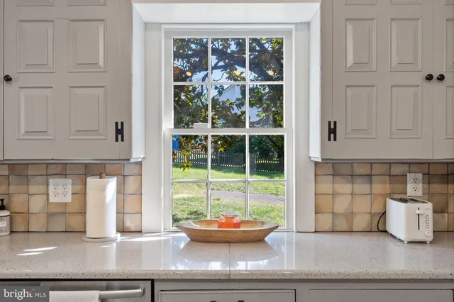 a bedroom with furniture and a fireplace