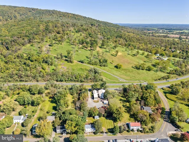 a view of a field with an outdoor space