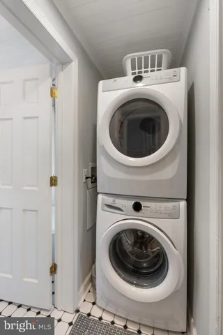 a view of a patio with a dining table and chairs