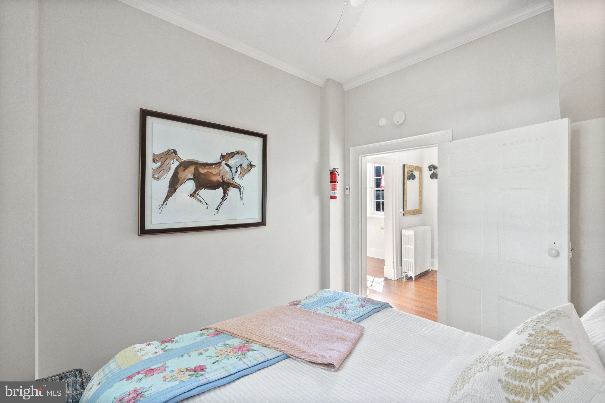 677 Federal Street Paris, VA 20130 - Photo 35 of 82 a bedroom with a bed and a painting on the wall