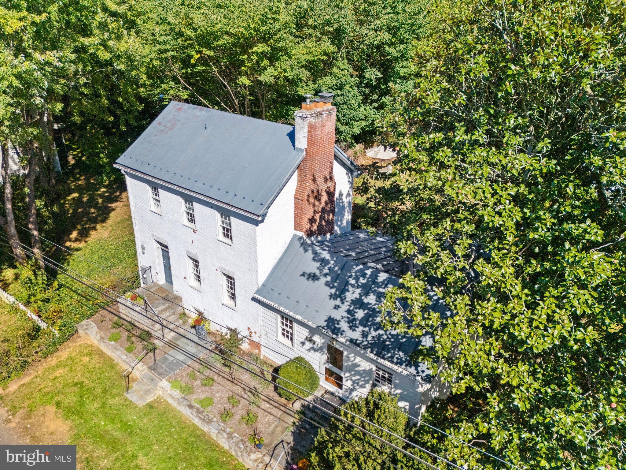 677 Federal Street Paris, VA 20130 - Photo 7 of 82 a view of a house with a yard and large trees