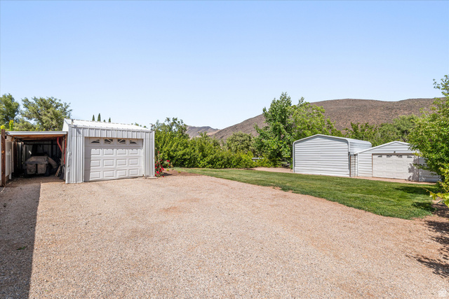 246 West Mount Charm Road Toquerville, UT 84774 - Photo 41 of 70 Detached garage with a mountain view and gravel driveway