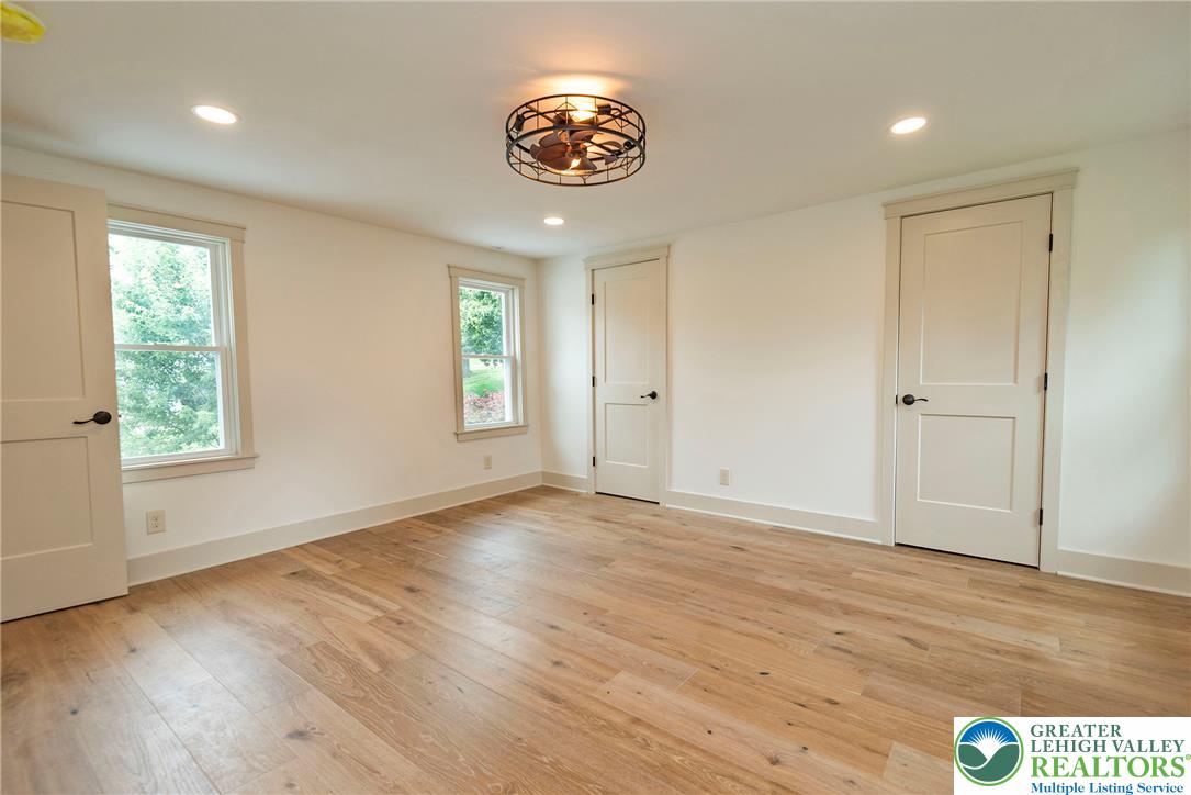 72 Allegheny Road Mount Bethel, PA 18343 - Photo 30 of 72 Hardwood floors and generous natural light create an inviting atmosphere in this flexible space.