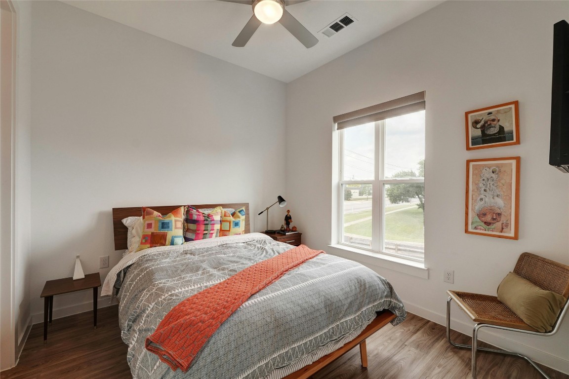 4901 Springdale Road, Unit 102 Austin, TX 78723 - Photo 20 of 30 a bedroom with a large bed and a window
