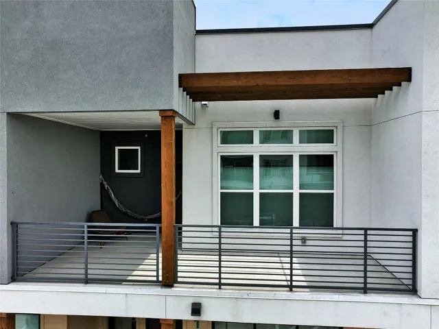 a view of a backyard with a patio and a garden