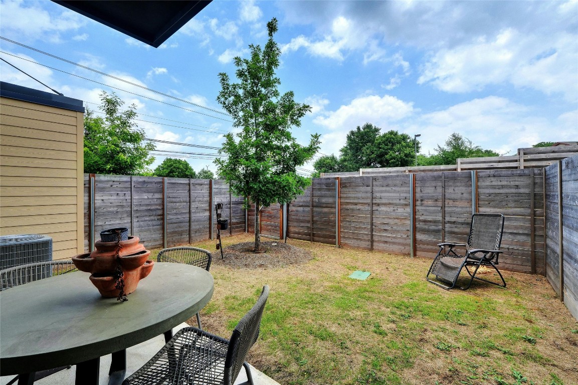 4901 Springdale Road, Unit 102 Austin, TX 78723 - Photo 28 of 30 a view of a backyard with a patio and a garden