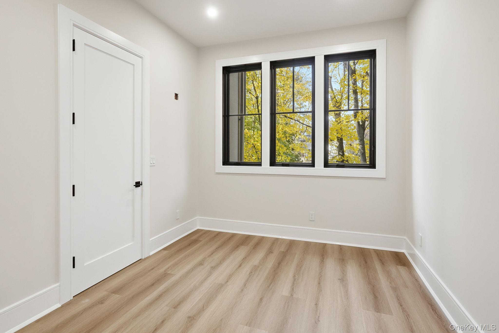 34 Clinton Avenue, Unit 2 Dobbs Ferry, NY 10522 - Photo 11 of 12 a view of an empty room with wooden floor and a window