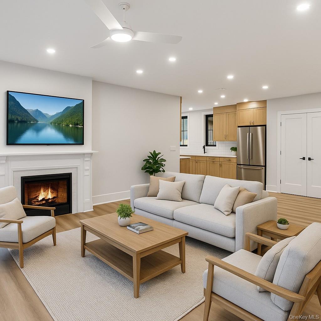 34 Clinton Avenue, Unit 2 Dobbs Ferry, NY 10522 - Photo 2 of 12 a living room with furniture and a fireplace
