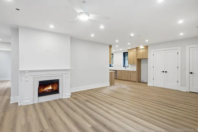 a view of an empty room with a fireplace