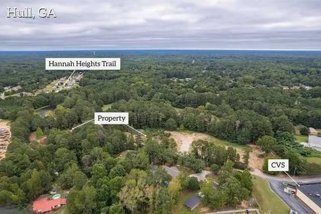 an aerial view of a house with yard and outdoor seating