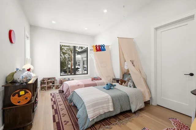 a bedroom with bed and a window