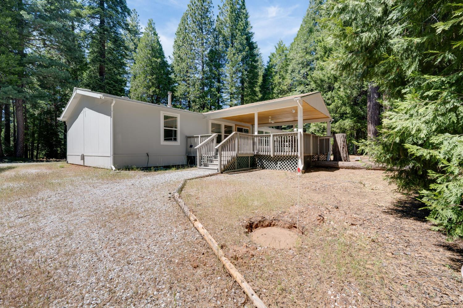 28722 Wood Road Pioneer, CA 95666 - Photo 7 of 39 a view of a house with a yard and sitting area