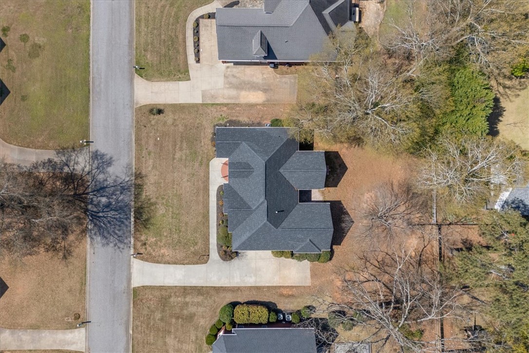 128 Cayman Way Anderson, SC 29621 - Photo 39 of 49 This birds-eye view showcases a residential property with ample outdoor space and mature trees.
