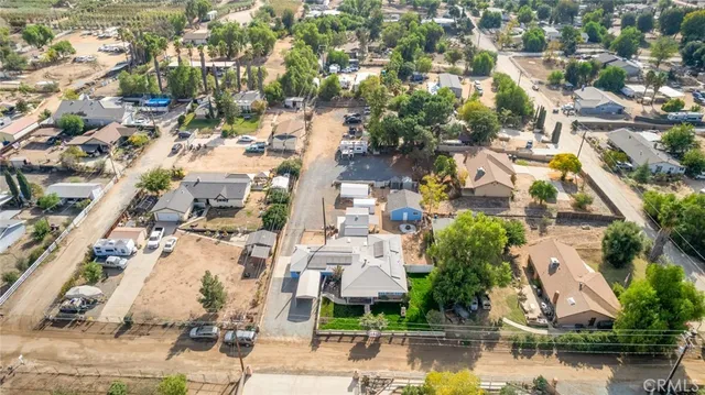 an aerial view of residential houses with lake