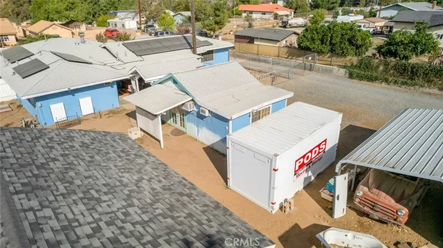 an aerial view of a house with a yard