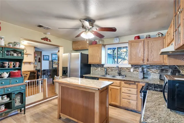 a kitchen that has a lot of cabinets in it