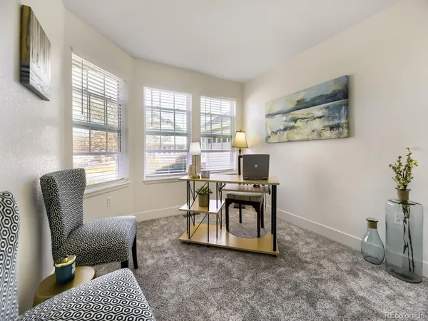 a work room with furniture and a window