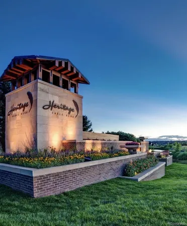 an aerial view of a house with a big yard