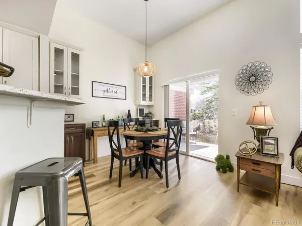 a view of a dining room with furniture window and wooden floor