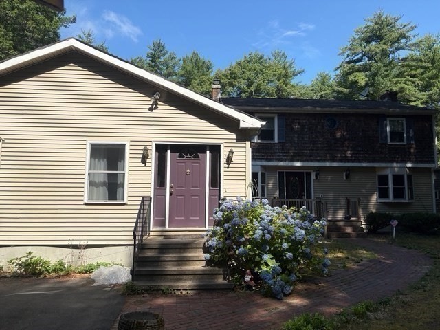 88 Colby Drive Halifax, MA 02338 - Photo 1 of 38 a front view of a house with a yard