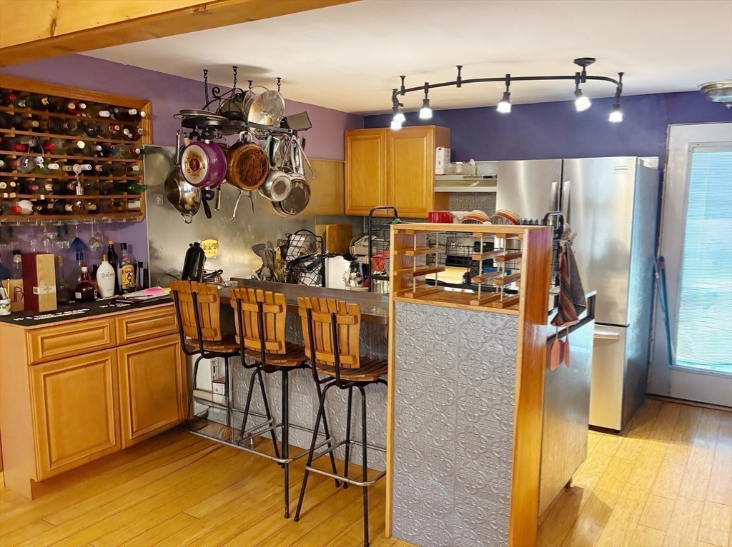 88 Colby Drive Halifax, MA 02338 - Photo 18 of 38 a kitchen with stainless steel appliances granite countertop a sink and cabinets