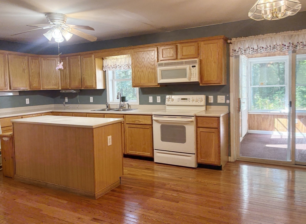 88 Colby Drive Halifax, MA 02338 - Photo 2 of 38 a kitchen with a stove a sink and a refrigerator