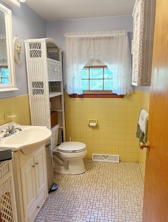 88 Colby Drive Halifax, MA 02338 - Photo 21 of 38 a bathroom with a sink a toilet and a window