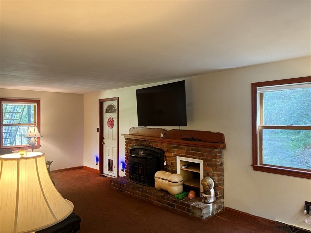 88 Colby Drive Halifax, MA 02338 - Photo 25 of 38 a room with furniture and a flat screen tv