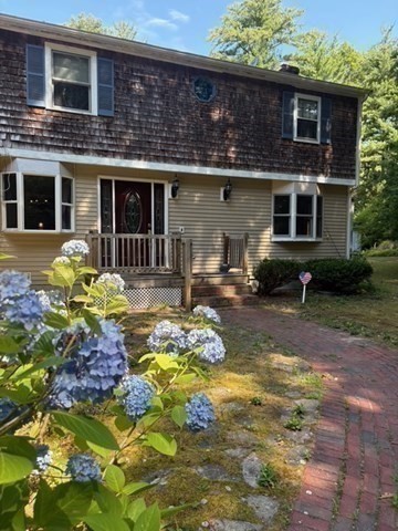 88 Colby Drive Halifax, MA 02338 - Photo 35 of 38 a front view of a house with a yard