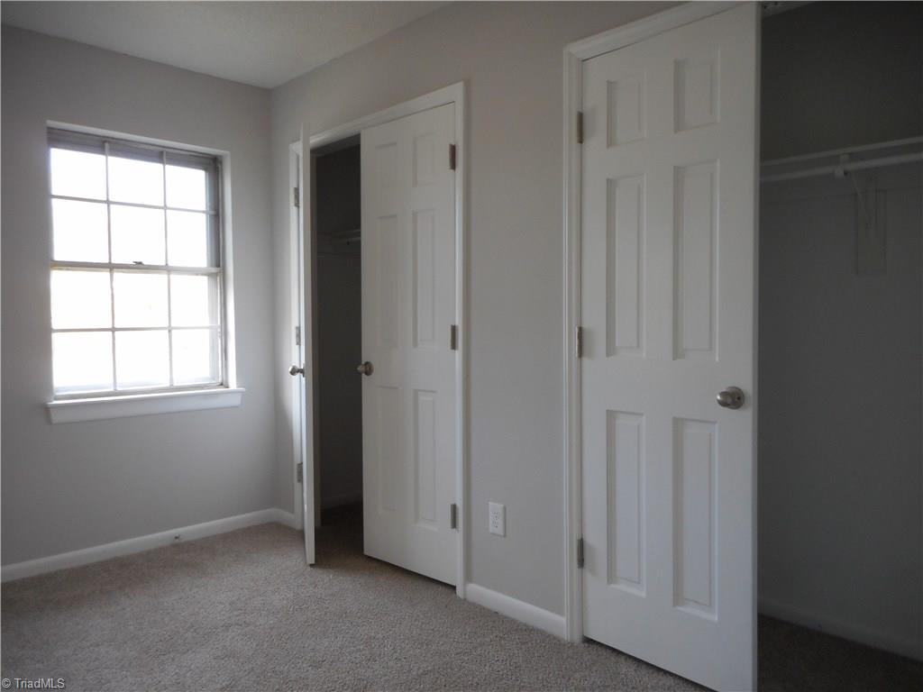 5725 Bramblegate Road, Unit F Greensboro, NC 27409 - Photo 14 of 30 Master Bedroom: Room features include fresh new paint, new carpet flooring, two windows for natural lighting and here we can see that you have two double door closets for all your fine clothes and shoes. Your master bedroom also has it's own full size bathroom.