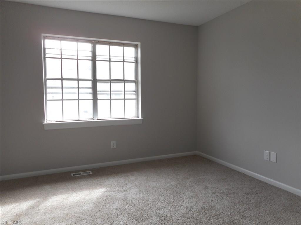 5725 Bramblegate Road, Unit F Greensboro, NC 27409 - Photo 19 of 30 Bedroom Two: Room features include fresh new paint, two windows for natural lighting, new carpet flooring and your own private full size bathroom.